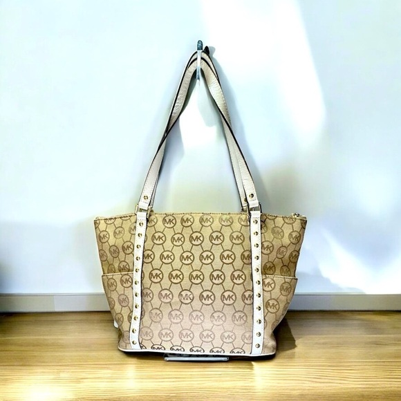 Michael Kors Handbags - Michael Kors Canvas Jet Set Tote with Circular Logo White Studded Leather Trim